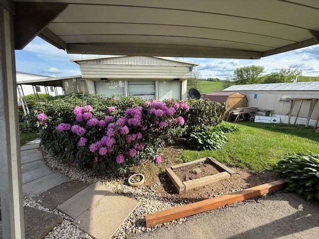 100 Rt 21 Estates Carmichaels, PA 15320 - Photo 18 of 21 a front view of a house with a yard potted plants