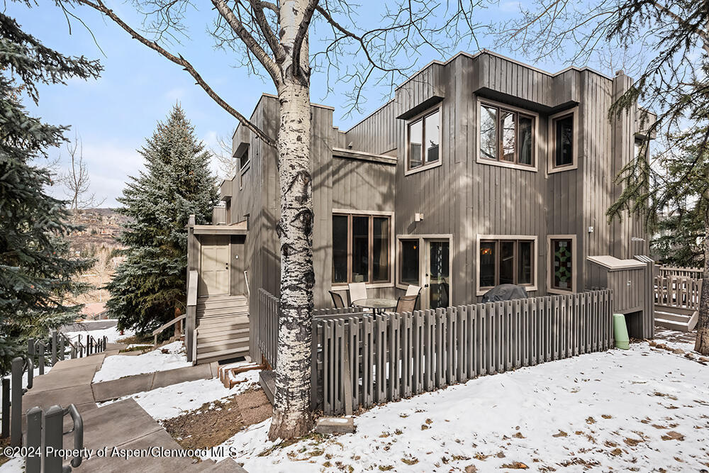 374 Meadow Ranch Road Snowmass Village, CO 81615 - Photo 1 of 22 a front view of a house with a yard