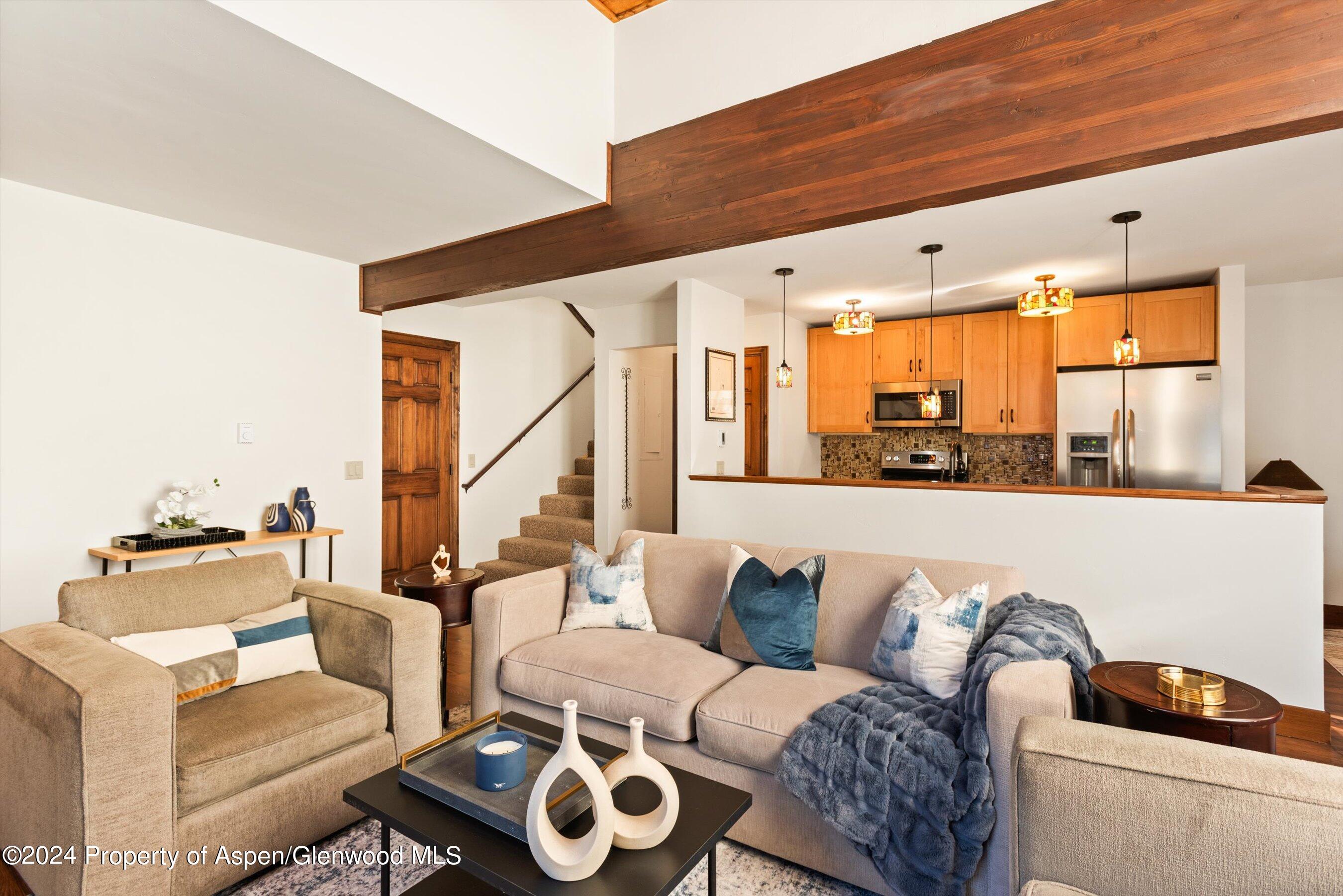 374 Meadow Ranch Road Snowmass Village, CO 81615 - Photo 6 of 22 a living room with furniture and a large window