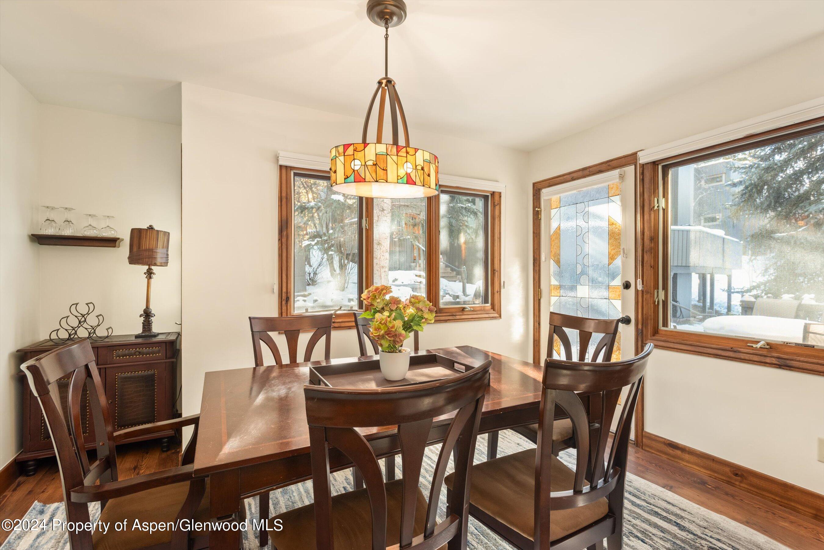 374 Meadow Ranch Road Snowmass Village, CO 81615 - Photo 10 of 22 a view of a dining room with furniture window and outside view