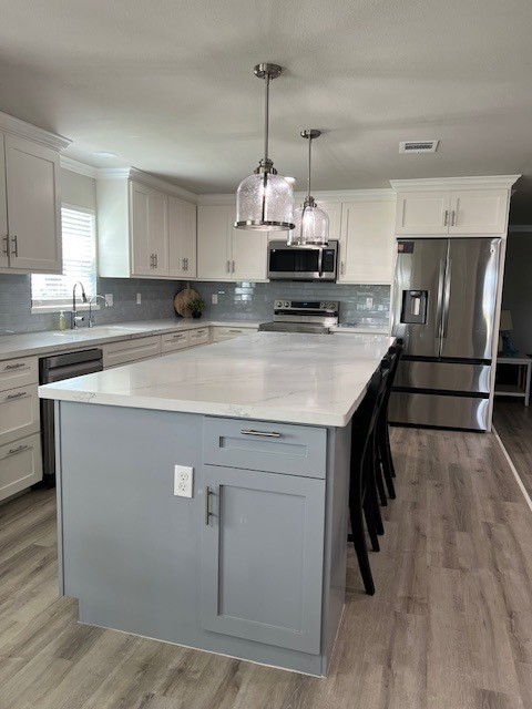 182 County Road 257 Matagorda, TX 77457 - Photo 11 of 24 a kitchen with stainless steel appliances a sink stove and refrigerator