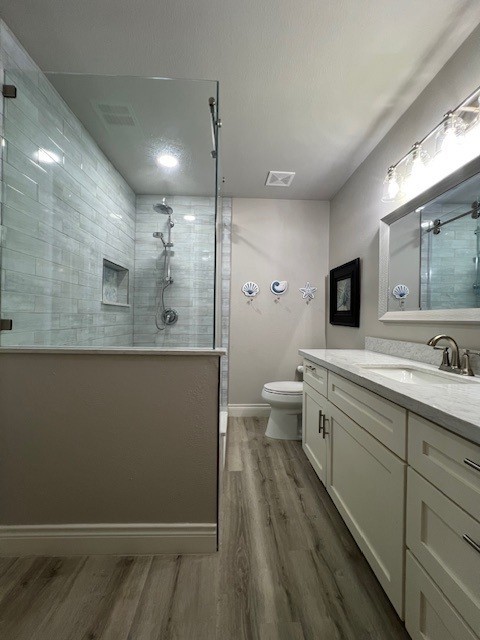 182 County Road 257 Matagorda, TX 77457 - Photo 14 of 24 a bathroom with a double vanity sink toilet and mirror