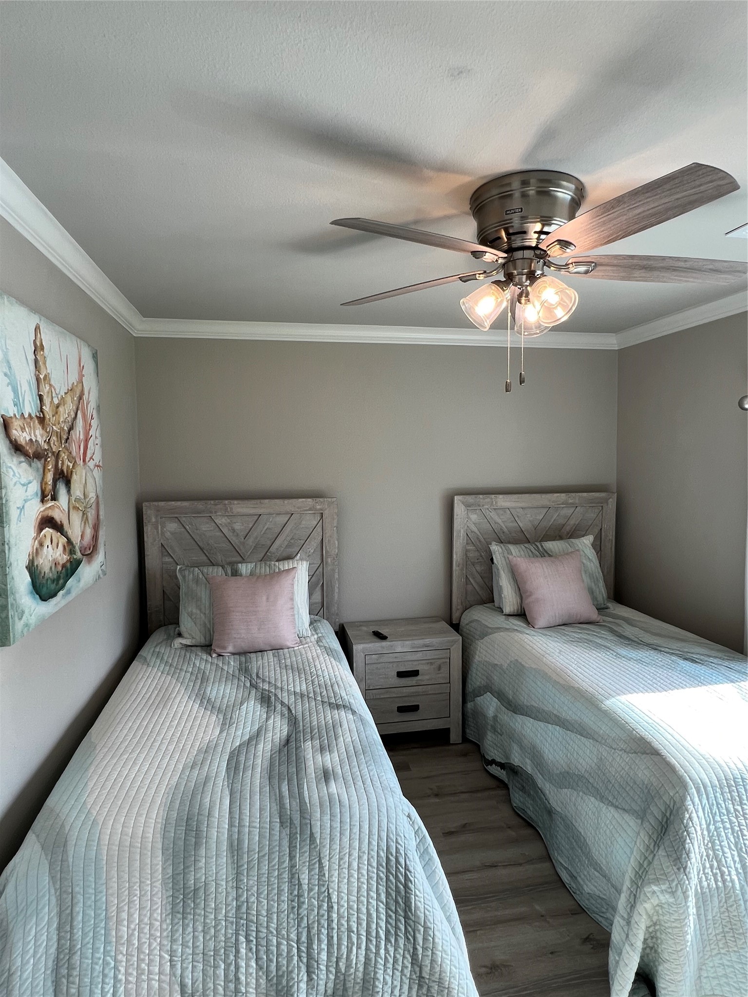 182 County Road 257 Matagorda, TX 77457 - Photo 17 of 24 a bedroom with a large bed and a chandelier
