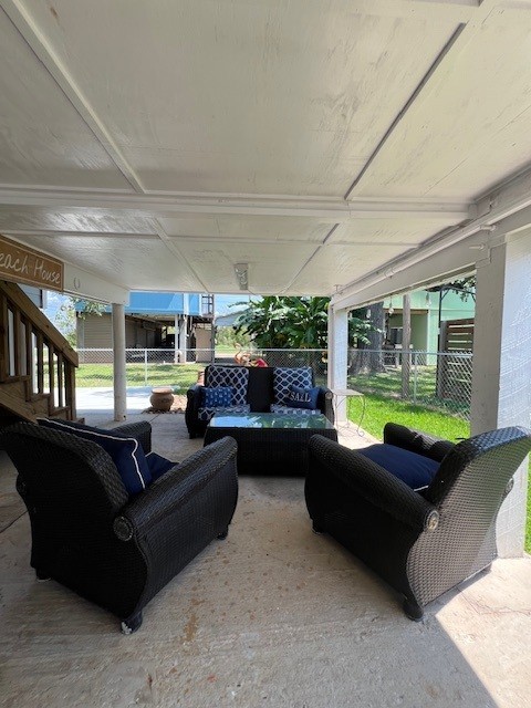 182 County Road 257 Matagorda, TX 77457 - Photo 22 of 24 a living room with furniture and a flat screen tv