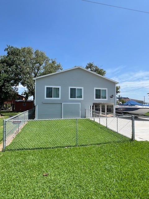 182 County Road 257 Matagorda, TX 77457 - Photo 4 of 24 a house view with a garden space