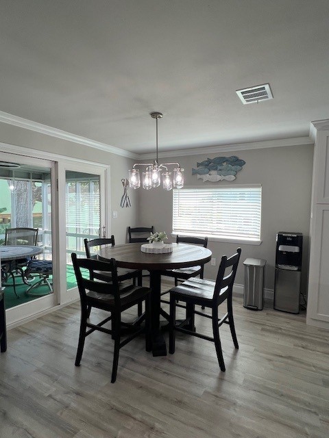 182 County Road 257 Matagorda, TX 77457 - Photo 7 of 24 a view of a dining room with furniture and wooden floor
