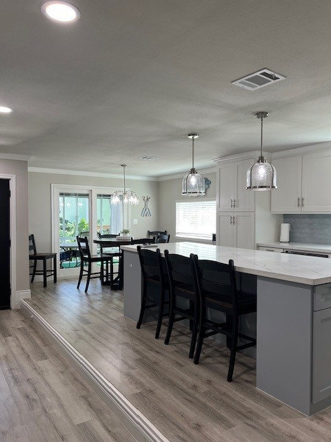 182 County Road 257 Matagorda, TX 77457 - Photo 10 of 24 a kitchen with lots of wooden furniture dining table and chairs