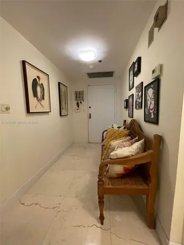 a bedroom with a bed and a night stand