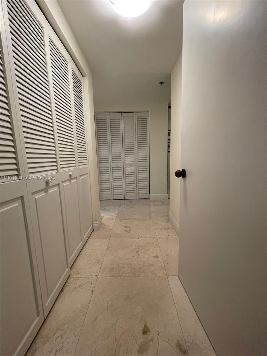 251 Crandon Boulevard, Unit 233 Key Biscayne, FL 33149 - Photo 19 of 27 an empty room with a window