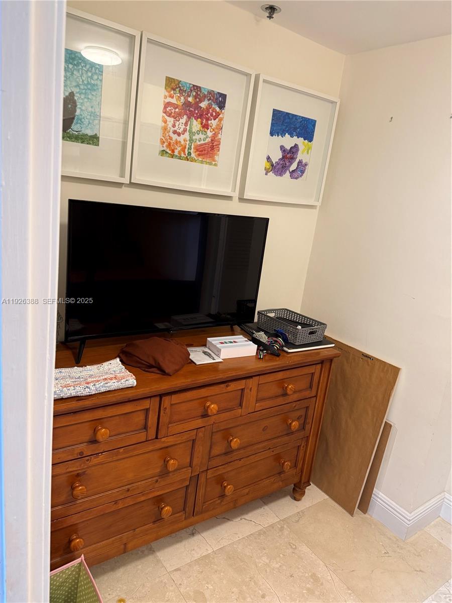 251 Crandon Boulevard, Unit 233 Key Biscayne, FL 33149 - Photo 23 of 27 a room with an empty room