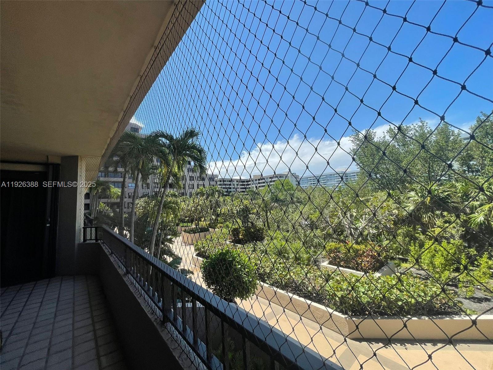 251 Crandon Boulevard, Unit 233 Key Biscayne, FL 33149 - Photo 6 of 27 a view of a garden from a balcony