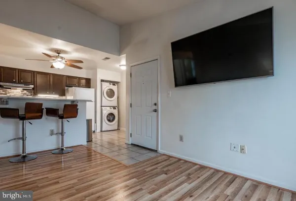 a view of a livingroom with furniture and flat screen tv