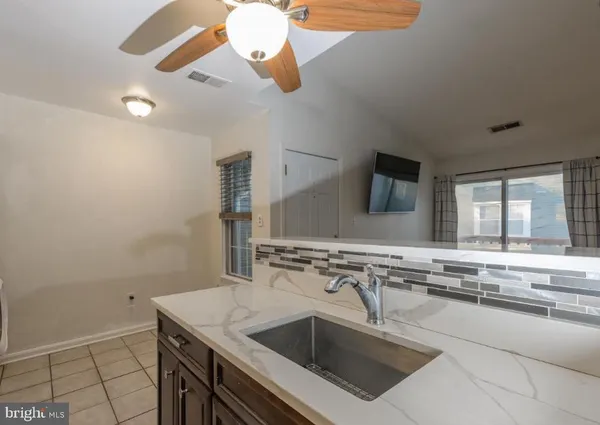 a kitchen with a stove and a sink