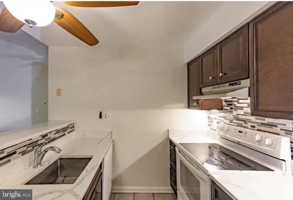 a spacious bedroom with a bed and a window