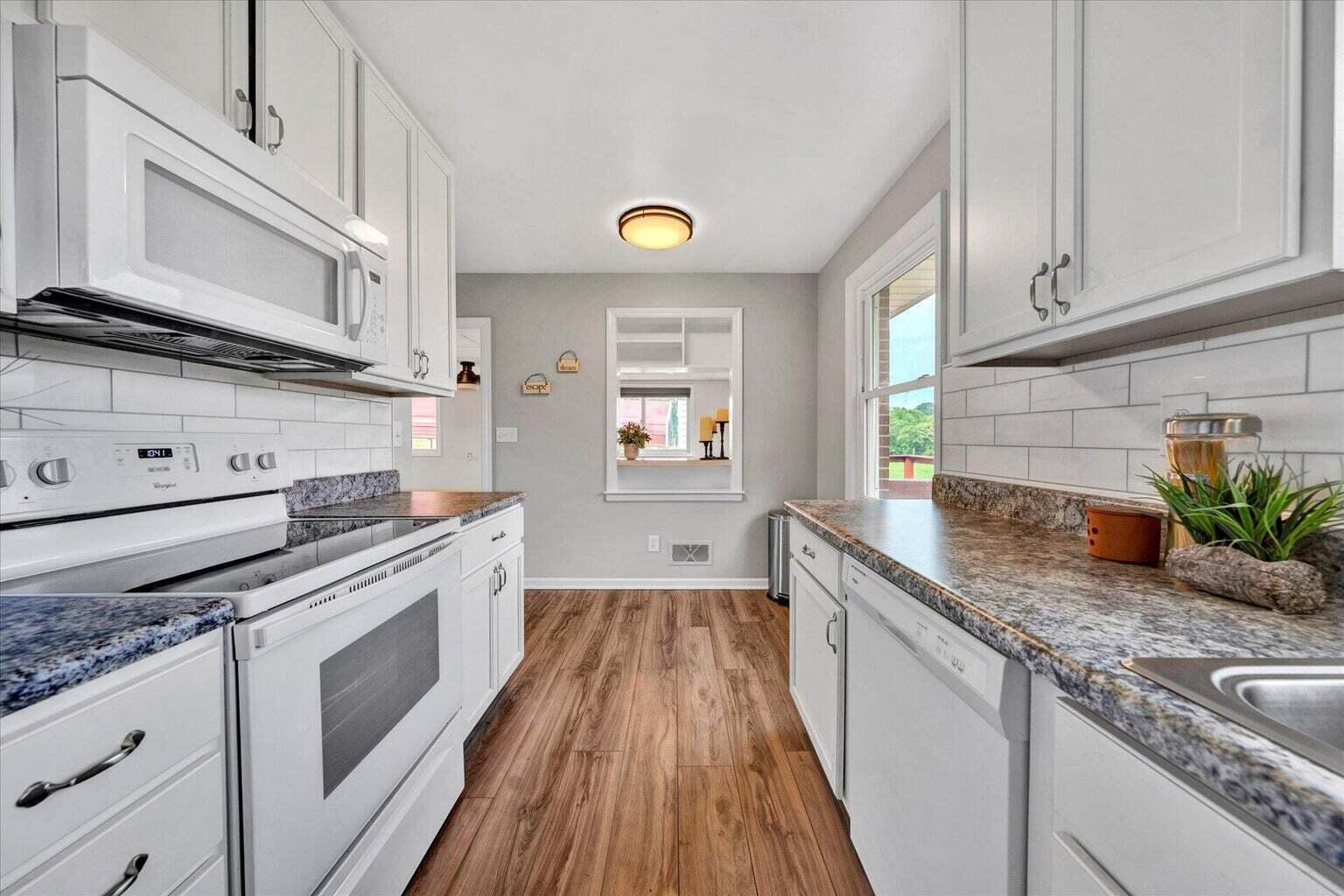 311 Moorman Road Hardy, VA 24101 - Photo 4 of 29 a kitchen with granite countertop a sink stainless steel appliances and cabinets