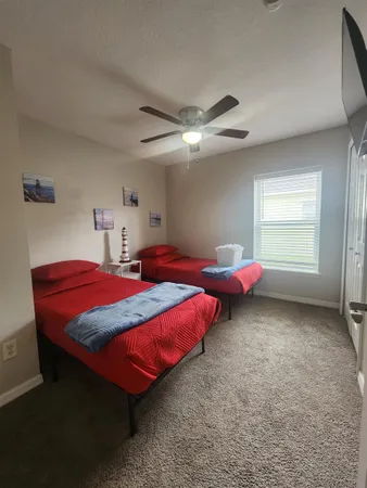 a bathroom with a sink a toilet a mirror and bathtub