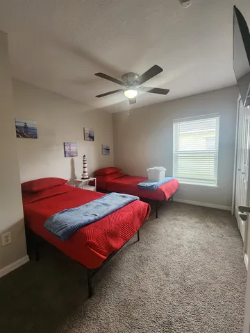 a bathroom with a sink a toilet a mirror and bathtub