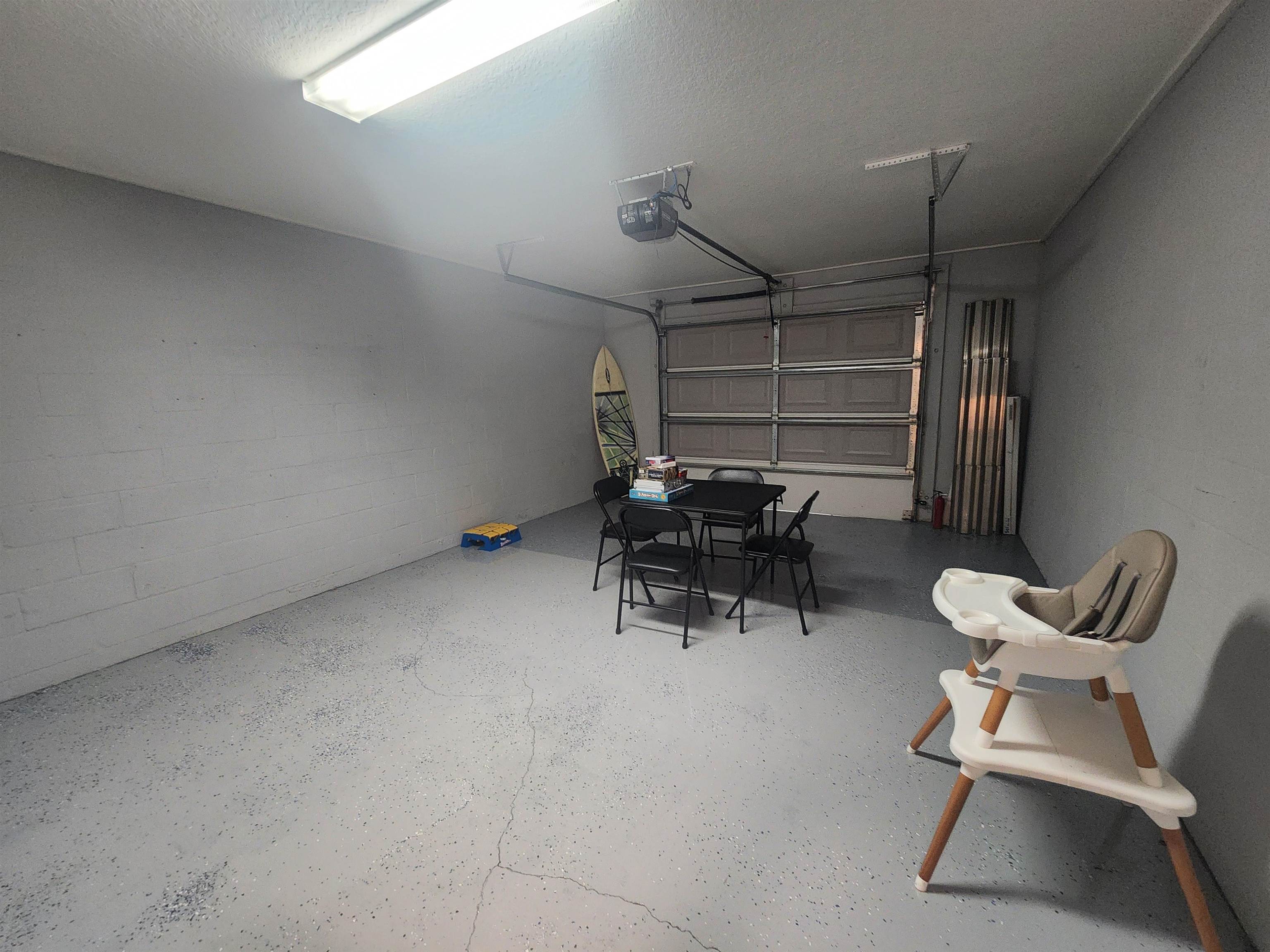 162 Stewart Street St. Augustine, FL 32084 - Photo 14 of 23 a room with a chair and white walls