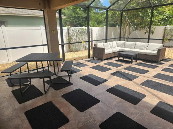 a room with a chair and white walls