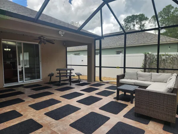 a view of a patio with a yard
