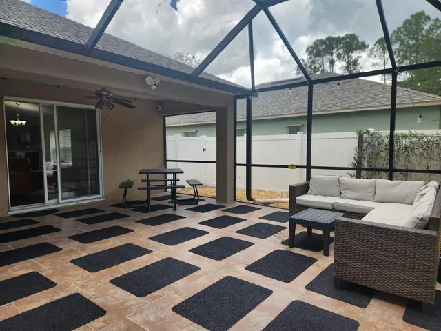 a view of a patio with a yard