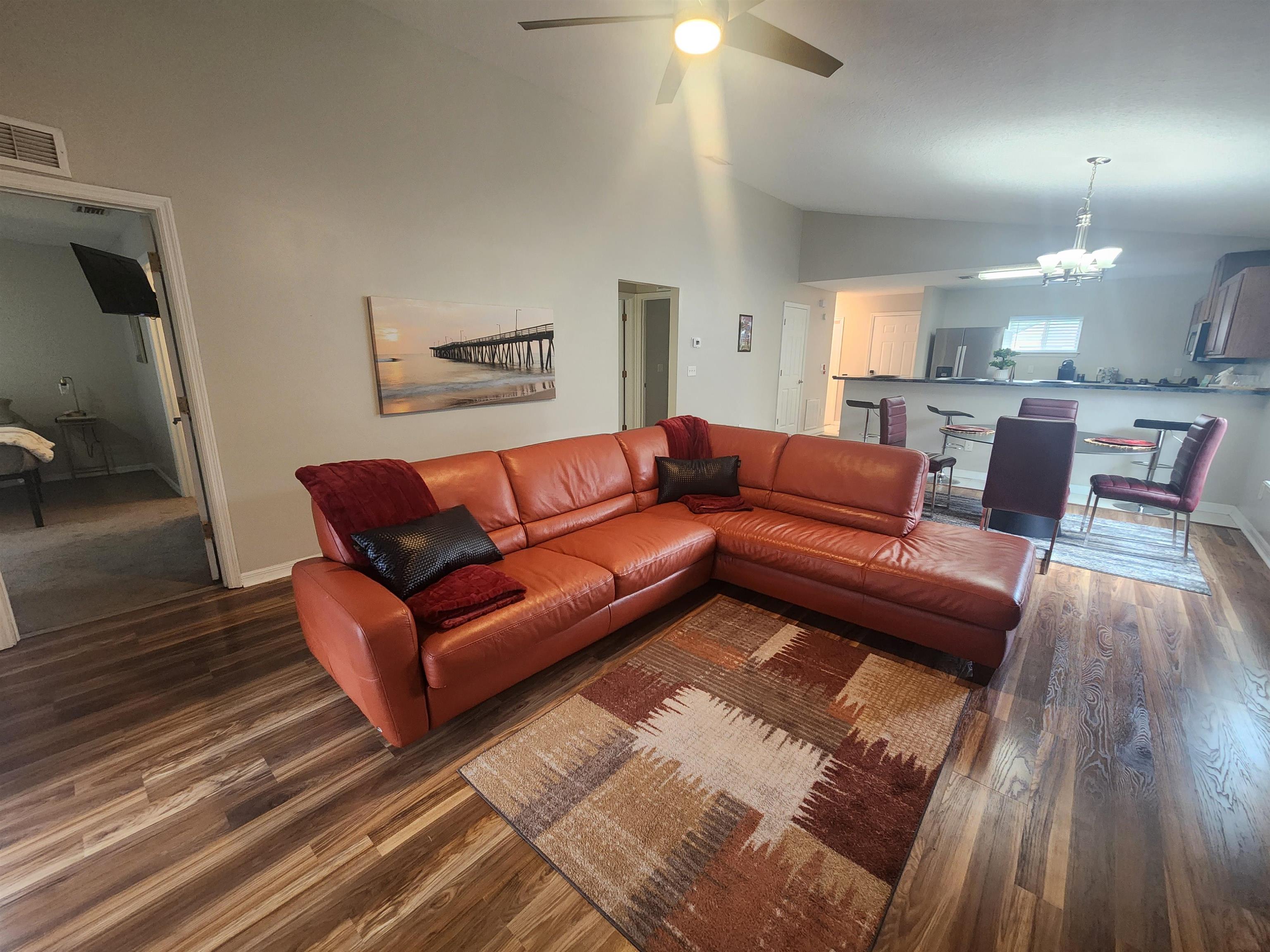 162 Stewart Street St. Augustine, FL 32084 - Photo 2 of 23 a living room with furniture and a wooden floor