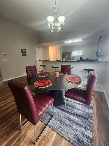 a kitchen with stainless steel appliances granite countertop a sink refrigerator stove and microwave