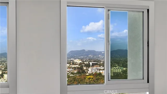 a view of a glass door and a window