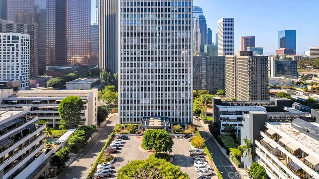 a view of a patio with couches table and chairs and potted plants