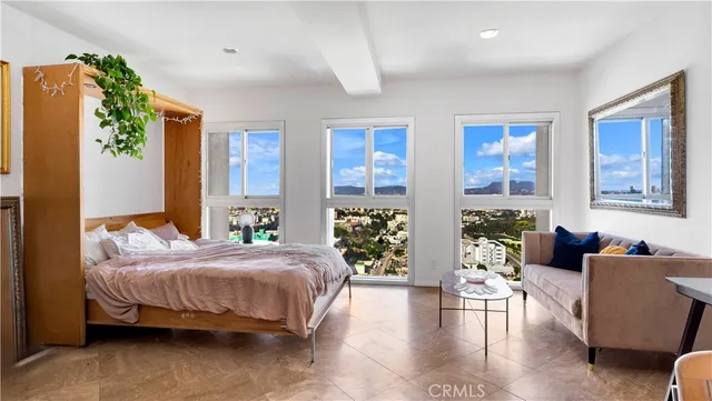 a bedroom with a bed and a couch