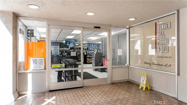 a view of a hallway with dining area