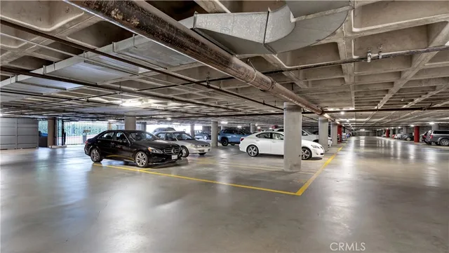 a view of parking space with parked cars