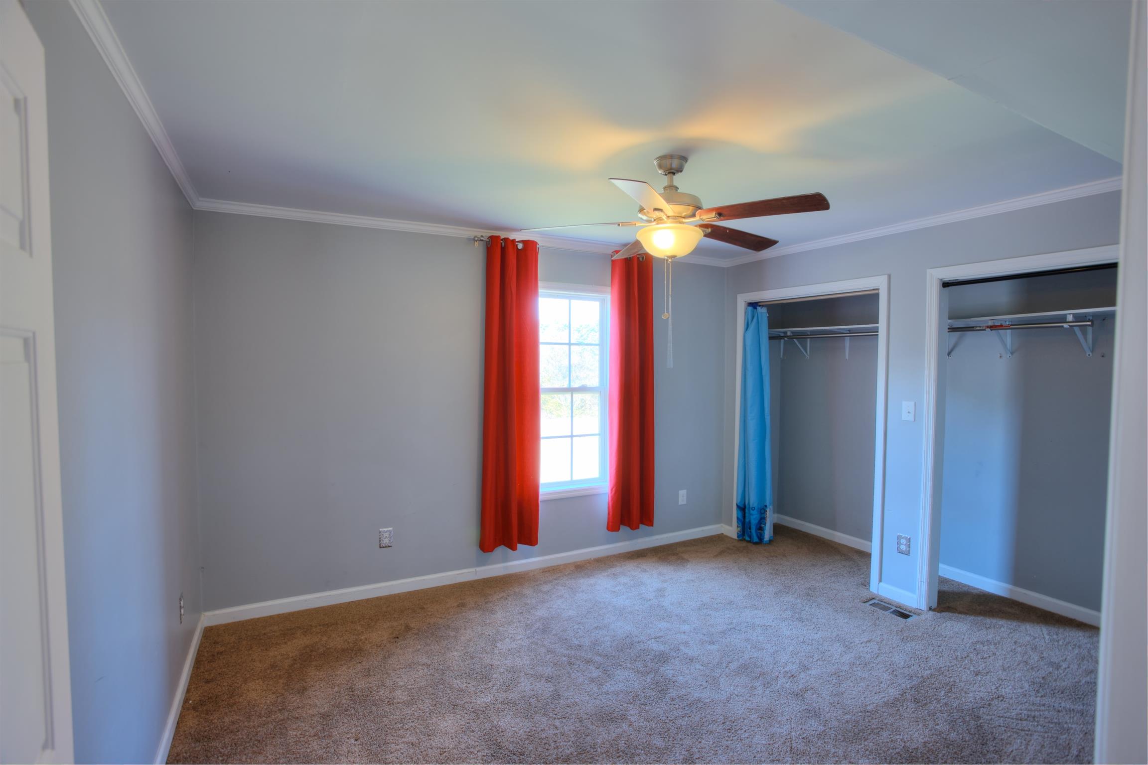 3343 Ridge Road Columbia, TN 38401 - Photo 22 of 27 a view of a livingroom with a chandelier fan and a ceiling fan