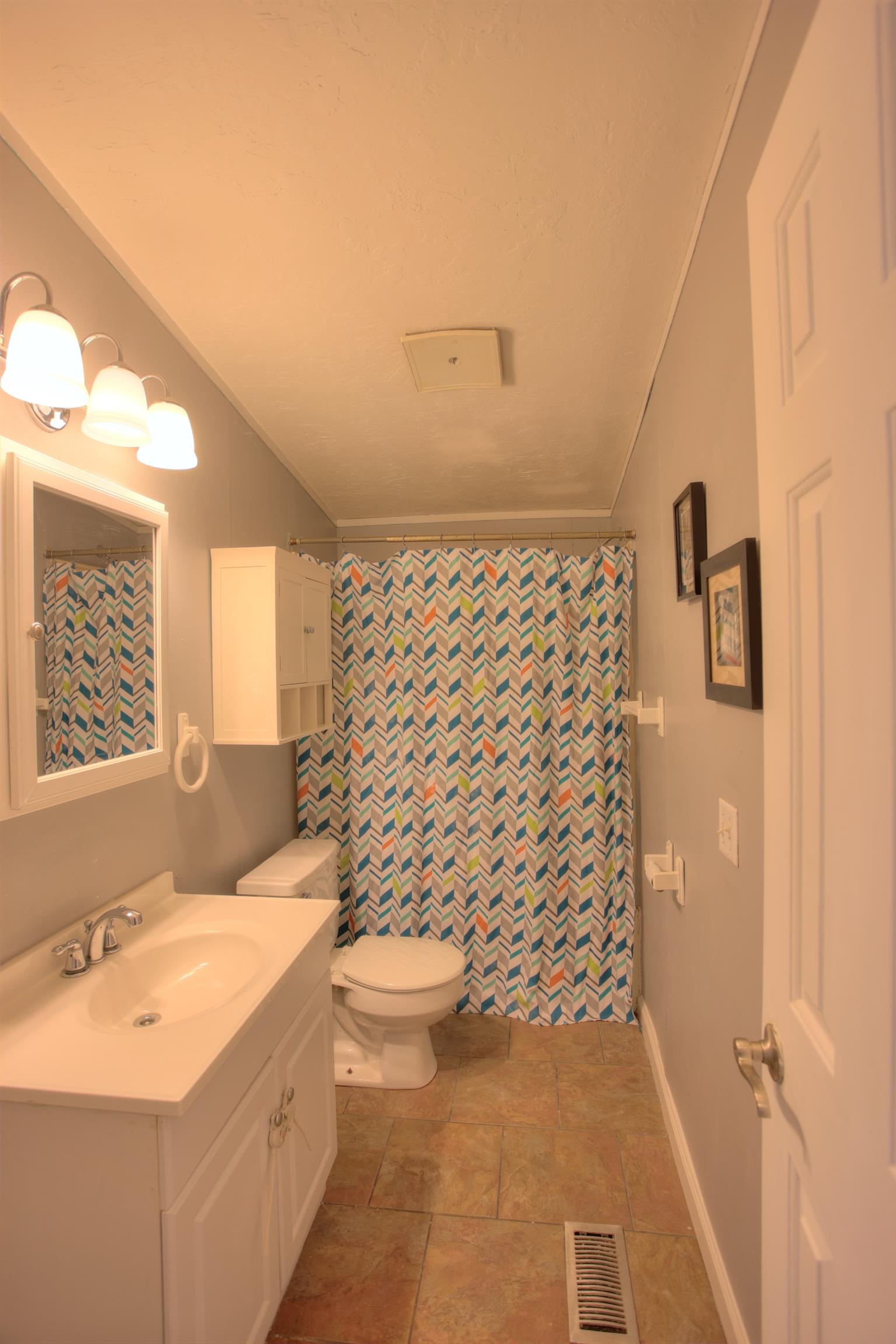 3343 Ridge Road Columbia, TN 38401 - Photo 23 of 27 a bathroom with a granite countertop sink a toilet and shower