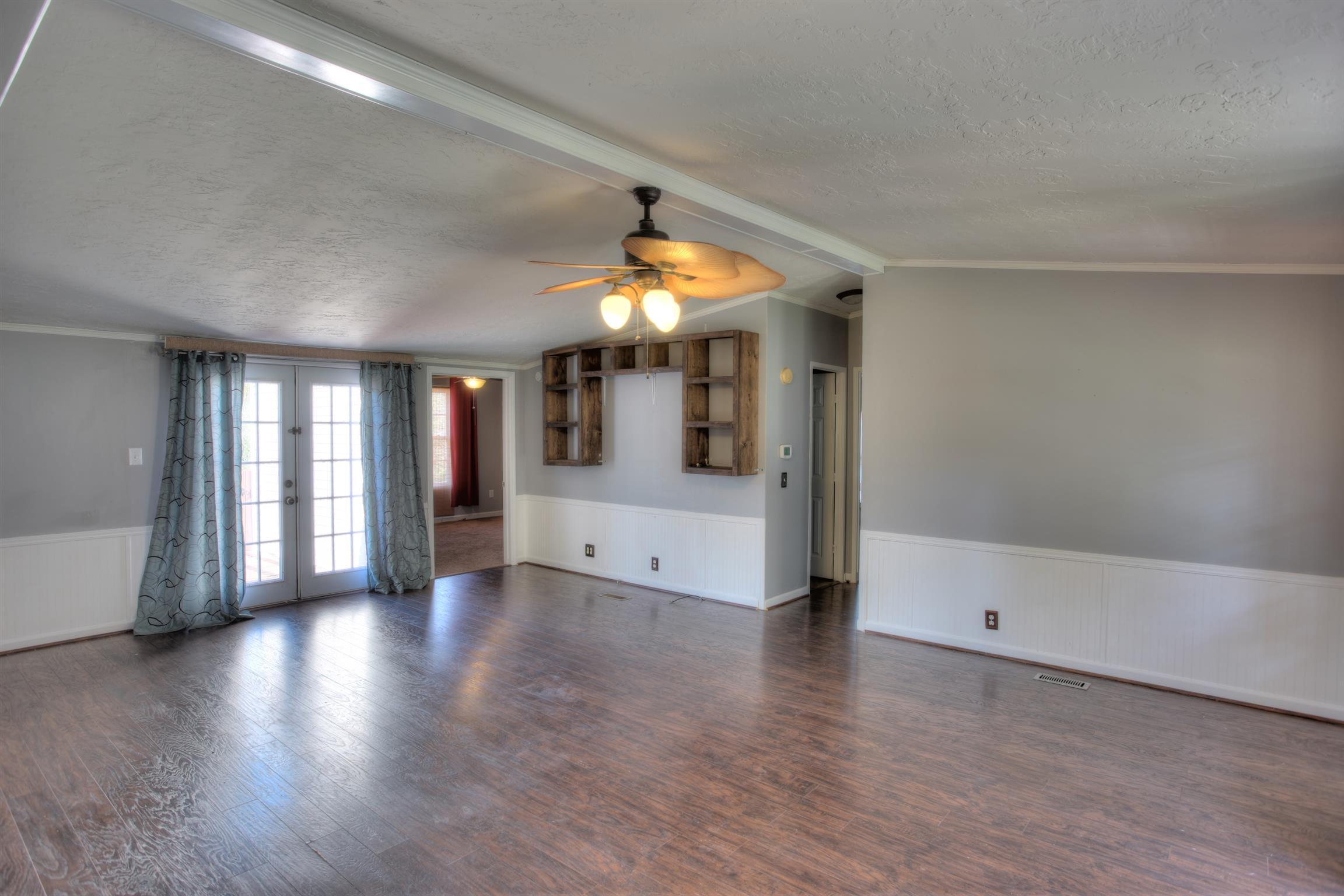 3343 Ridge Road Columbia, TN 38401 - Photo 8 of 27 wooden floor in an empty room with a window