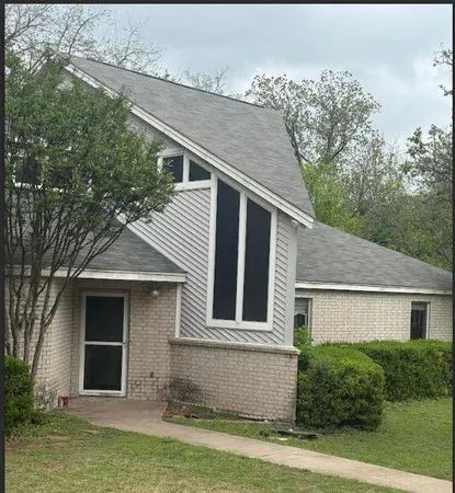 a front view of a house with a garage