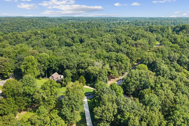 a view of a garden with a building