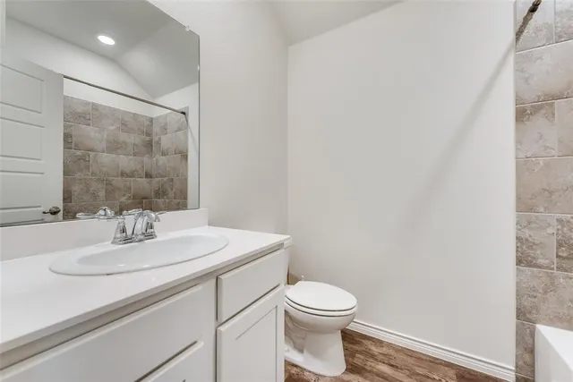 a bathroom with a bathtub and shower