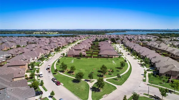 an aerial view of a golf course with swimming pool and outdoor space