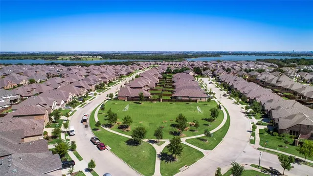 an aerial view of a golf course with swimming pool and outdoor space