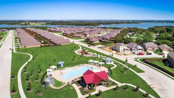 an aerial view of a golf course with seating space