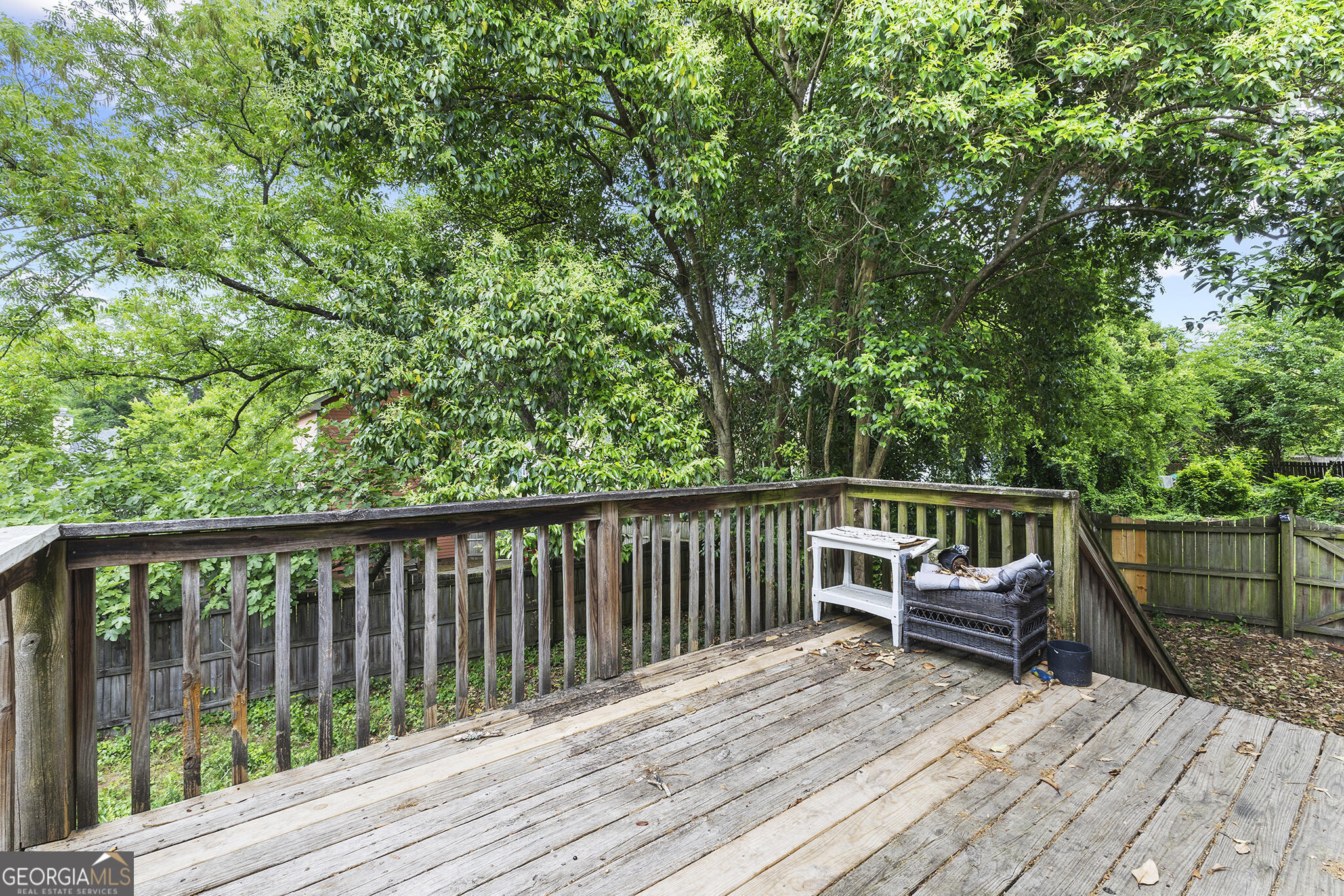 1469 Chestnut Street Macon, GA 31201 - Photo 24 of 26 a view of balcony with wooden floor and fence