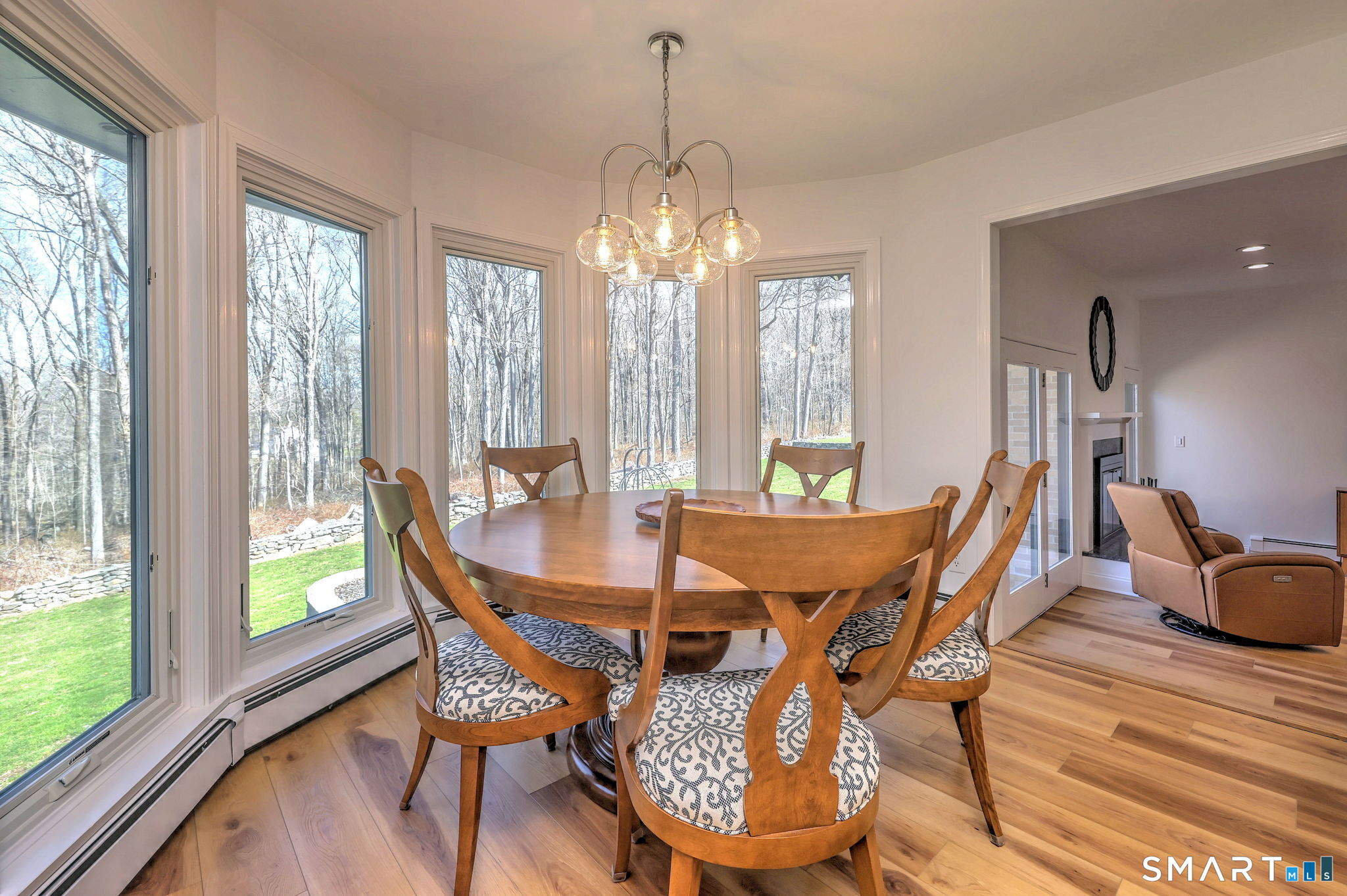 48 Nancy Drive Monroe, CT 06468 - Photo 14 of 38 a view of a dining room with furniture wooden floor and a chandelier