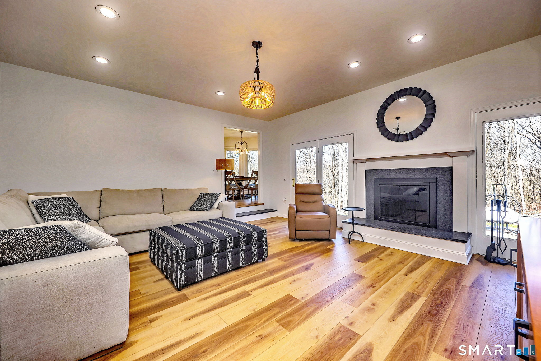 48 Nancy Drive Monroe, CT 06468 - Photo 15 of 38 a living room with furniture a fireplace and a ceiling fan