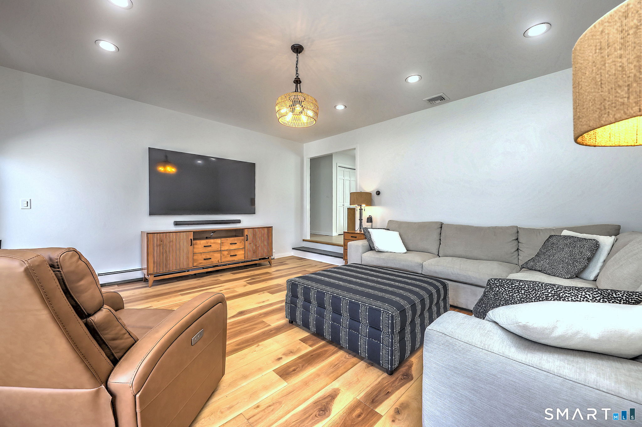 48 Nancy Drive Monroe, CT 06468 - Photo 16 of 38 a living room with furniture and a flat screen tv