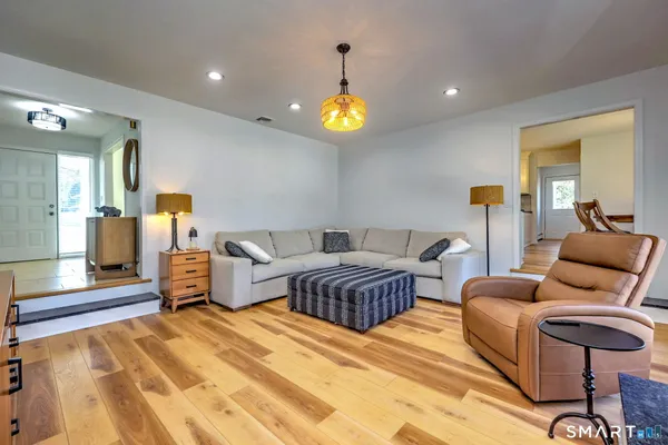 a spacious bedroom with a bed and furniture