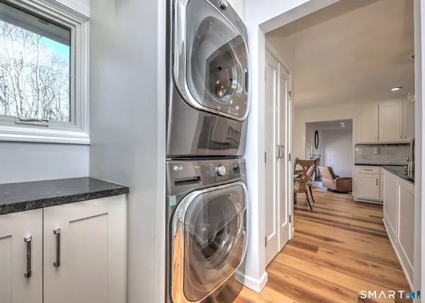 a view of a kitchen with washer and dryer