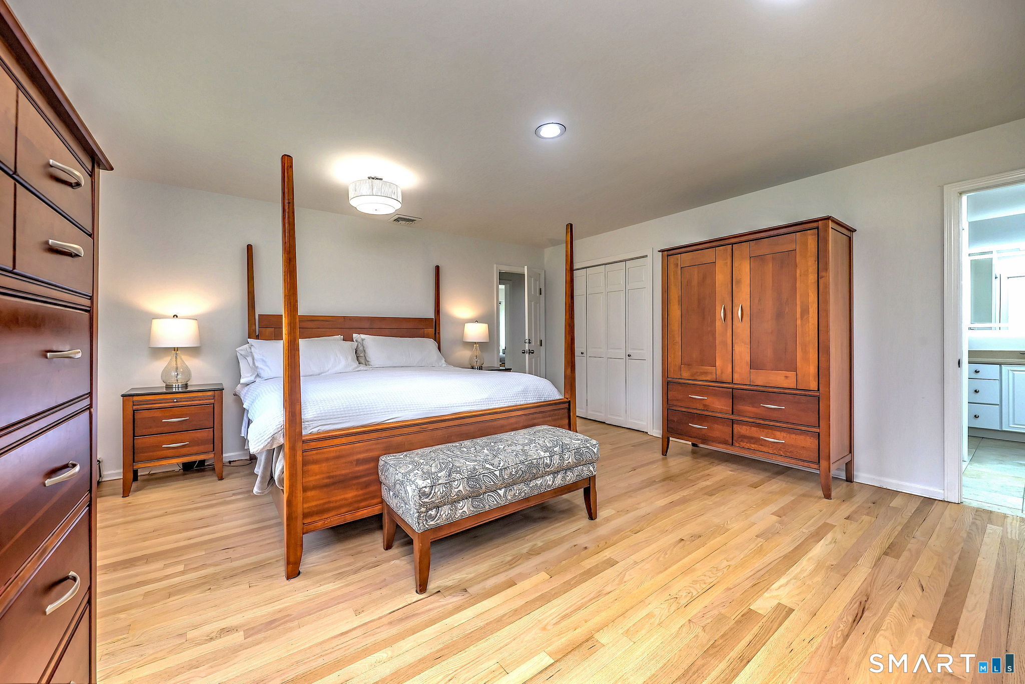 48 Nancy Drive Monroe, CT 06468 - Photo 22 of 38 a bedroom with a bed and wooden floor