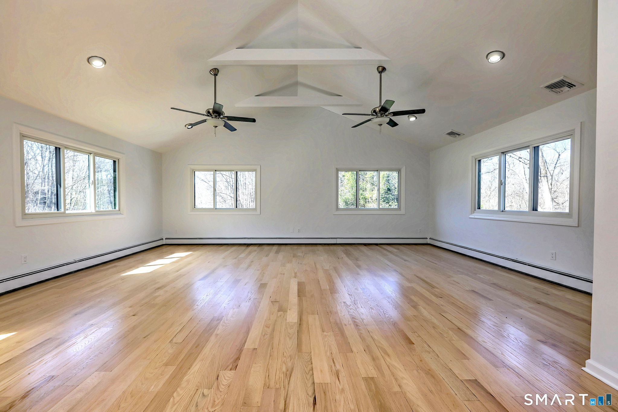 48 Nancy Drive Monroe, CT 06468 - Photo 28 of 38 a view of an empty room with a window and wooden floor
