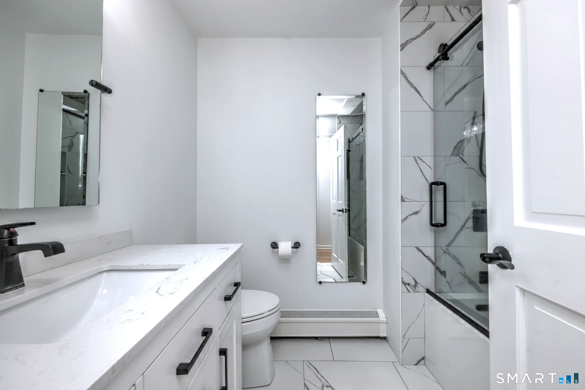 48 Nancy Drive Monroe, CT 06468 - Photo 30 of 38 a bathroom with a granite countertop sink a toilet and shower